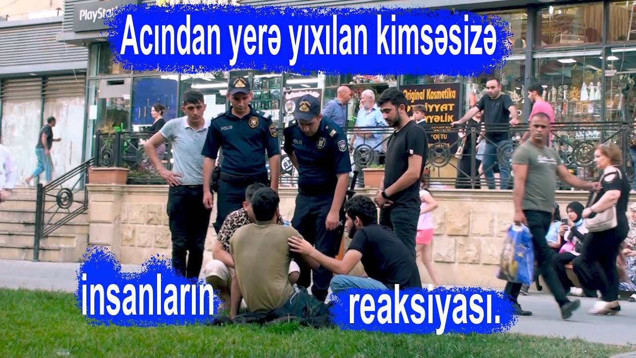 Acindan yere yixilan kimsesize insanlarin reaksiyasi.