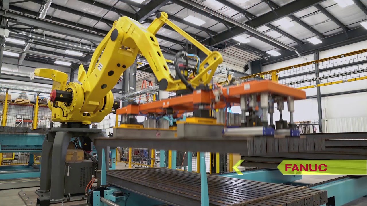 Automated System Uses Robots to Hang Steel I-Beams for Washing & Coating – TranTek Automation