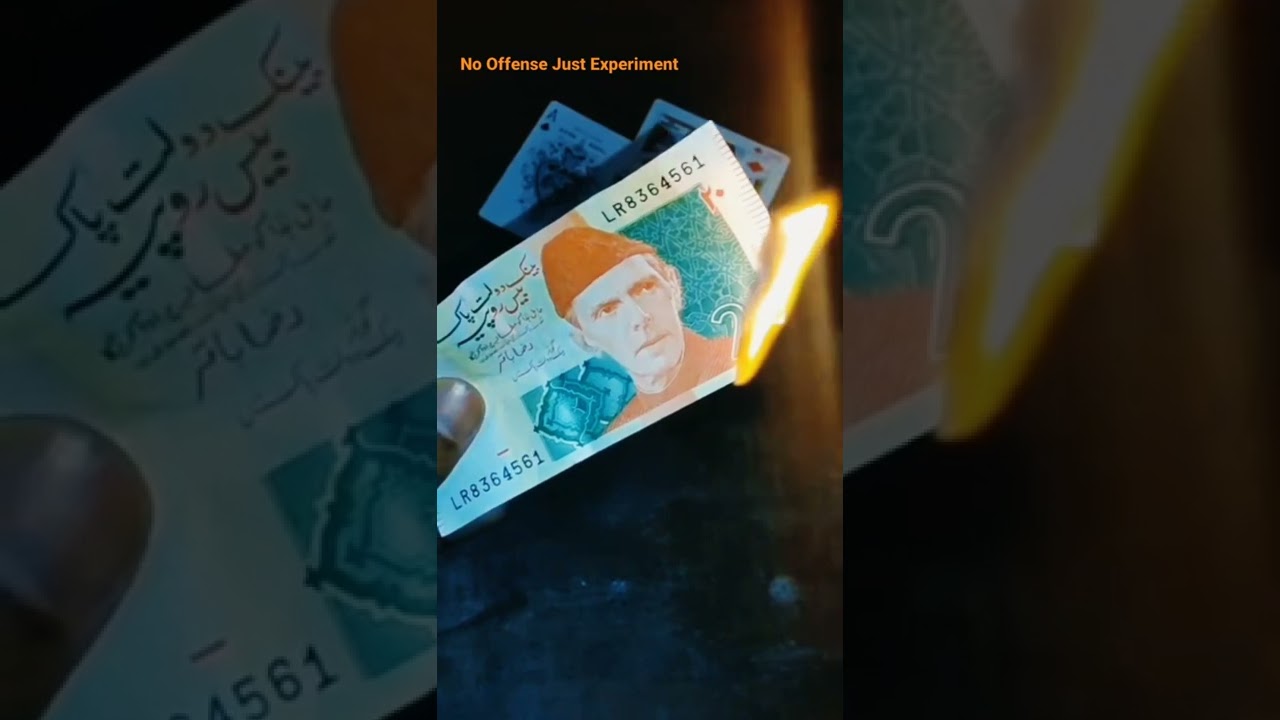 Burning Rs20 Pakistani note 