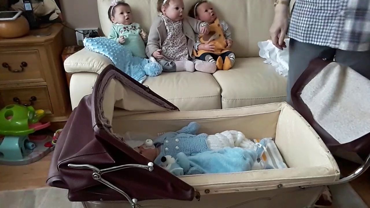 Vintage silver Cross dolls pram and little David