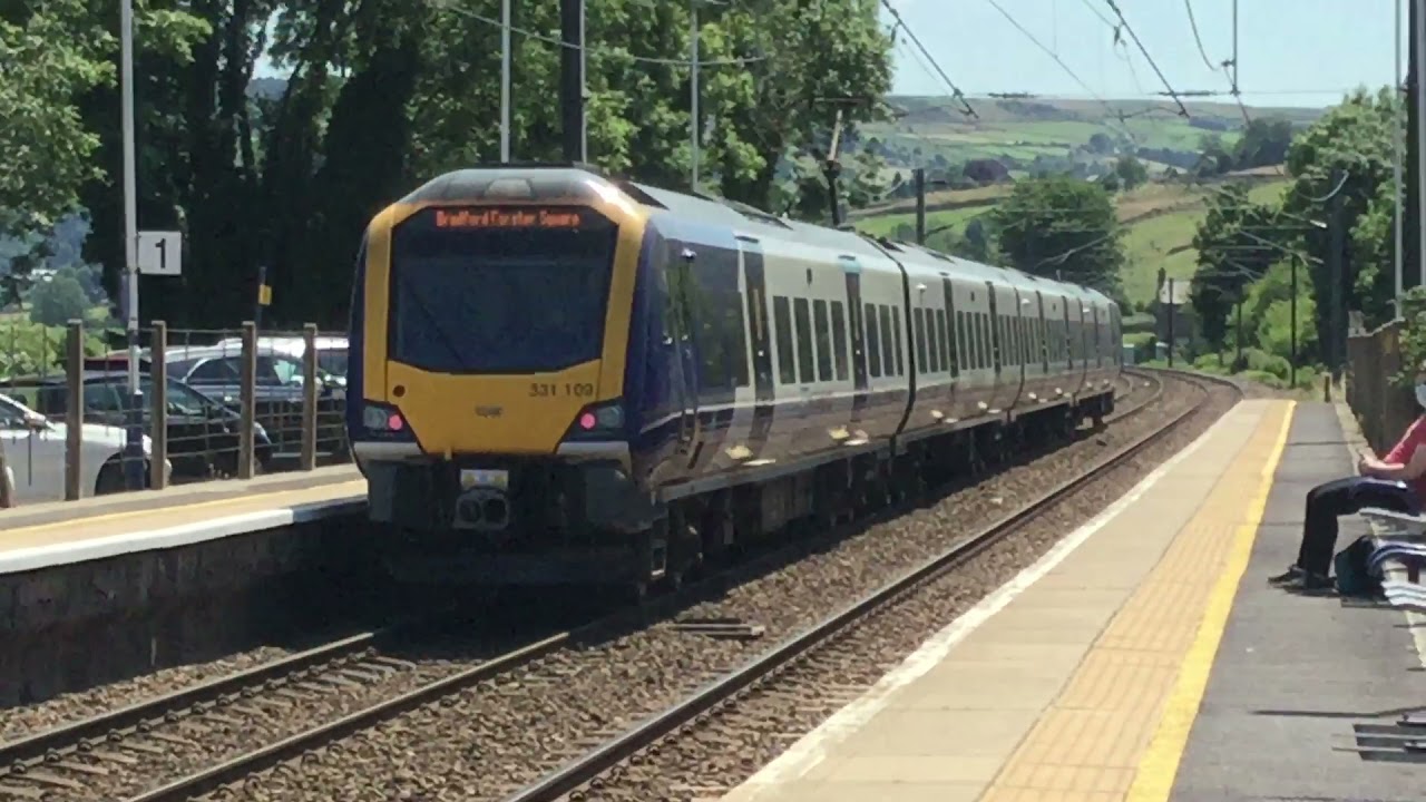 Class 331 and class 333 with ledgendary 7 tones at Cononley station and level crossing