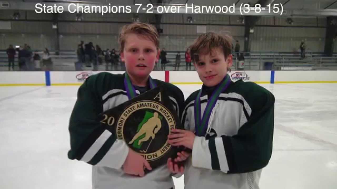 Atticus Eiden and Henry Paumgarten Communicate on the ice.