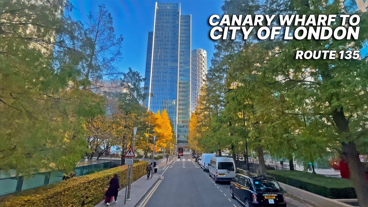 London double-decker Bus 135 travelling through London's financial hubs, Canary Wharf & the City 🏙