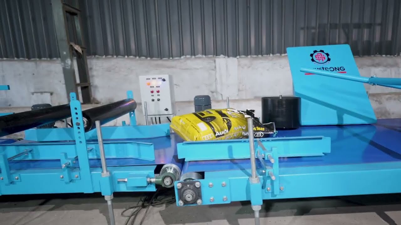 ARMSTRONG BAG TURNING & TILTING CONVEYOR WITH WEIGHING AND METAL DETECTOR SYSTEM