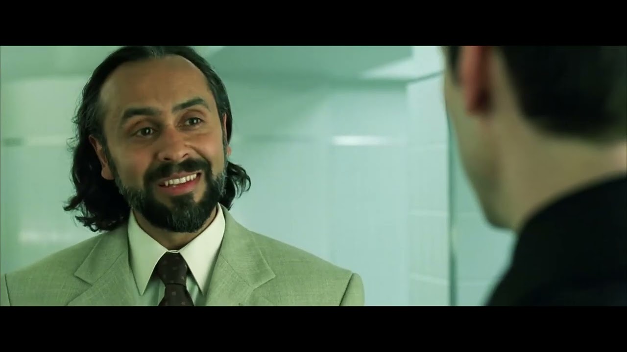 Neo discusses with Rama-Kandra and the Trainman