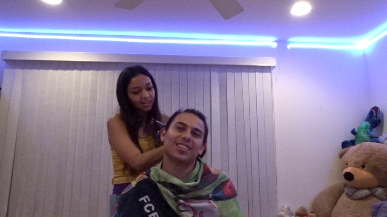 Girlfriend cuts boyfriend hair