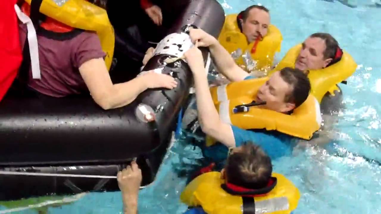 Entering the liferaft from the water