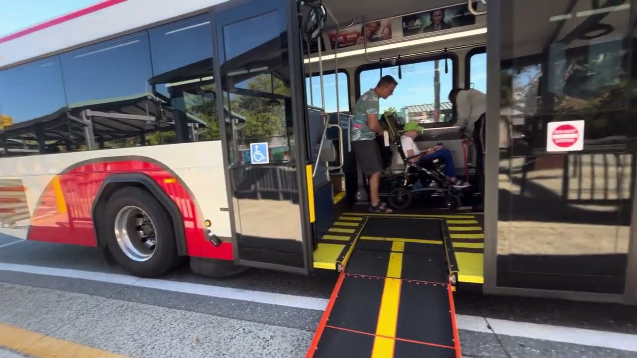 Kayden on new Disney Gillig Transport Bus Ramp Q’straint robot system Disney Springs @BusBoyKayden