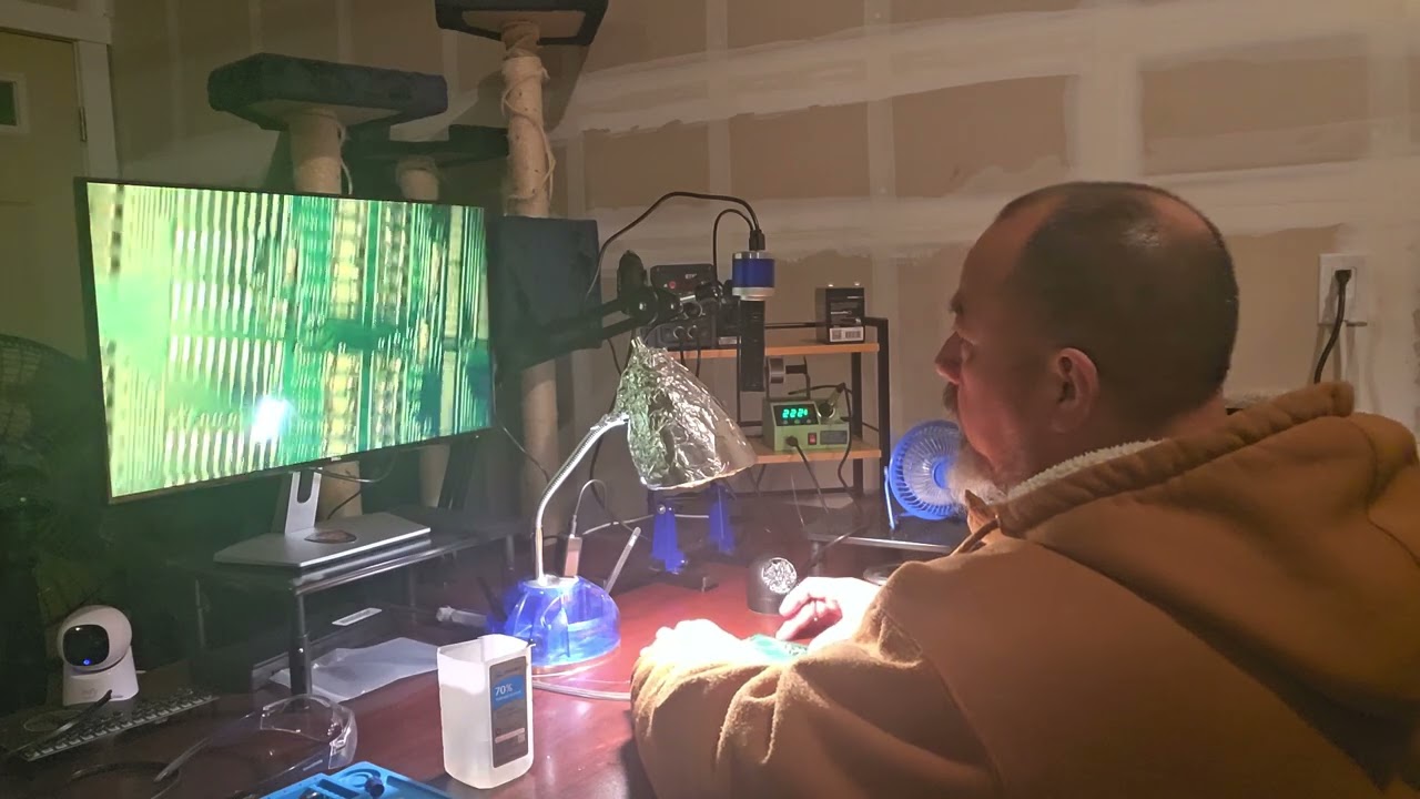 Soldering an oscillator still on practice board 