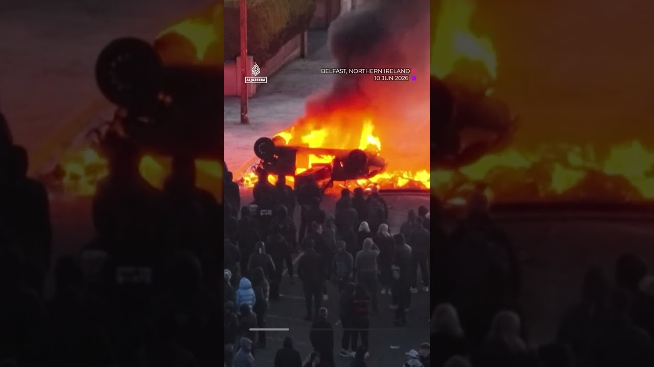 Anti-immigrant protesters clash with police, torch car at Belfast rally | AJ #shorts