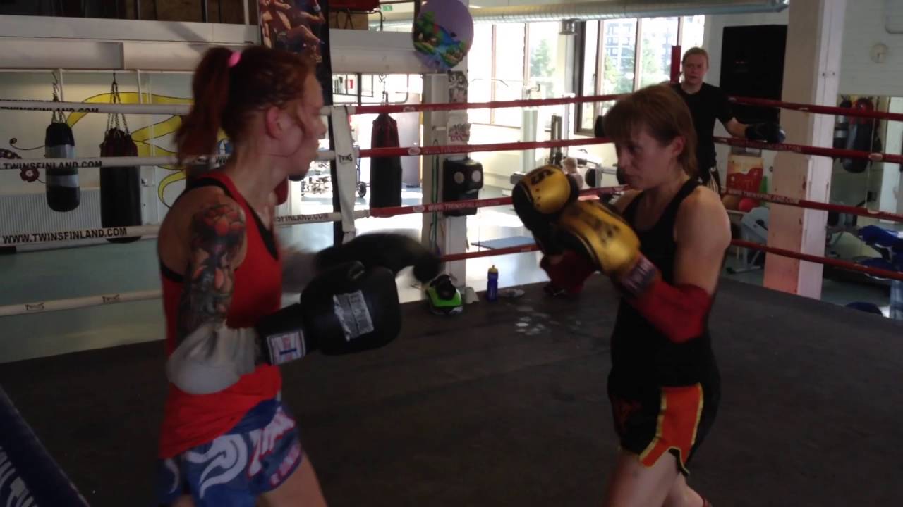 Female muay thai fighters sparring in TTBC