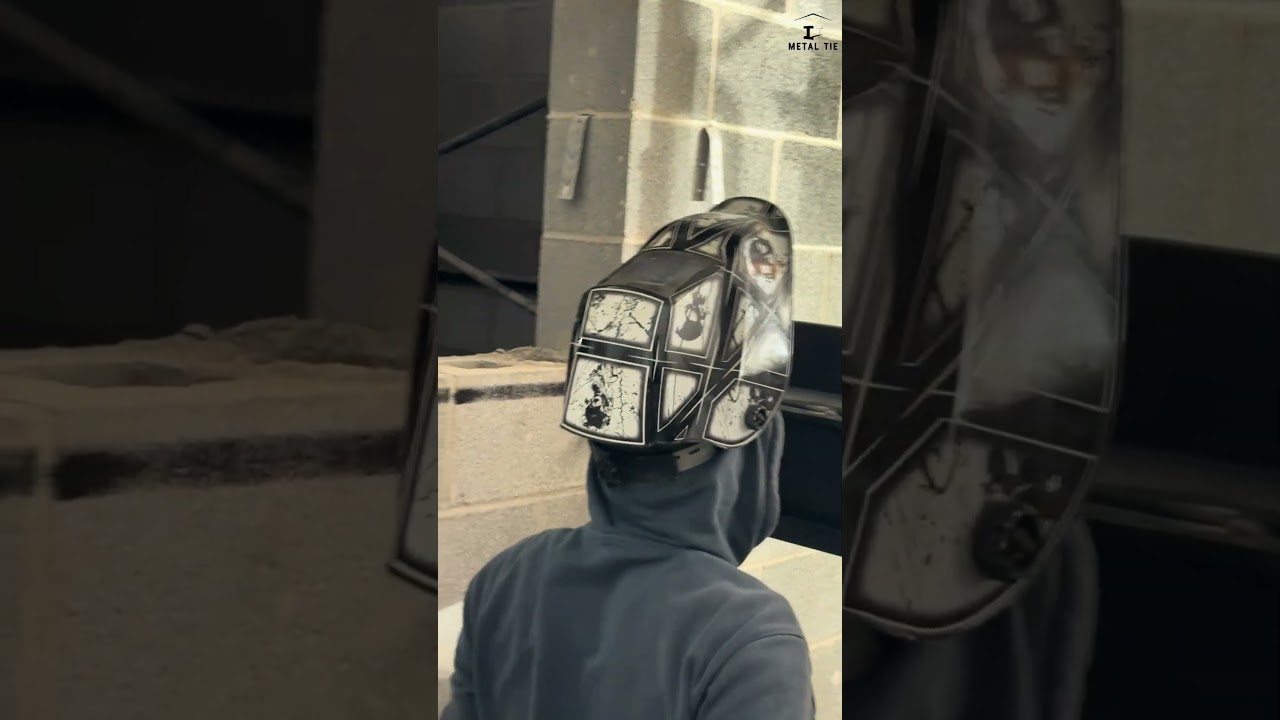 Stick welding beam and angle iron together both top of each other