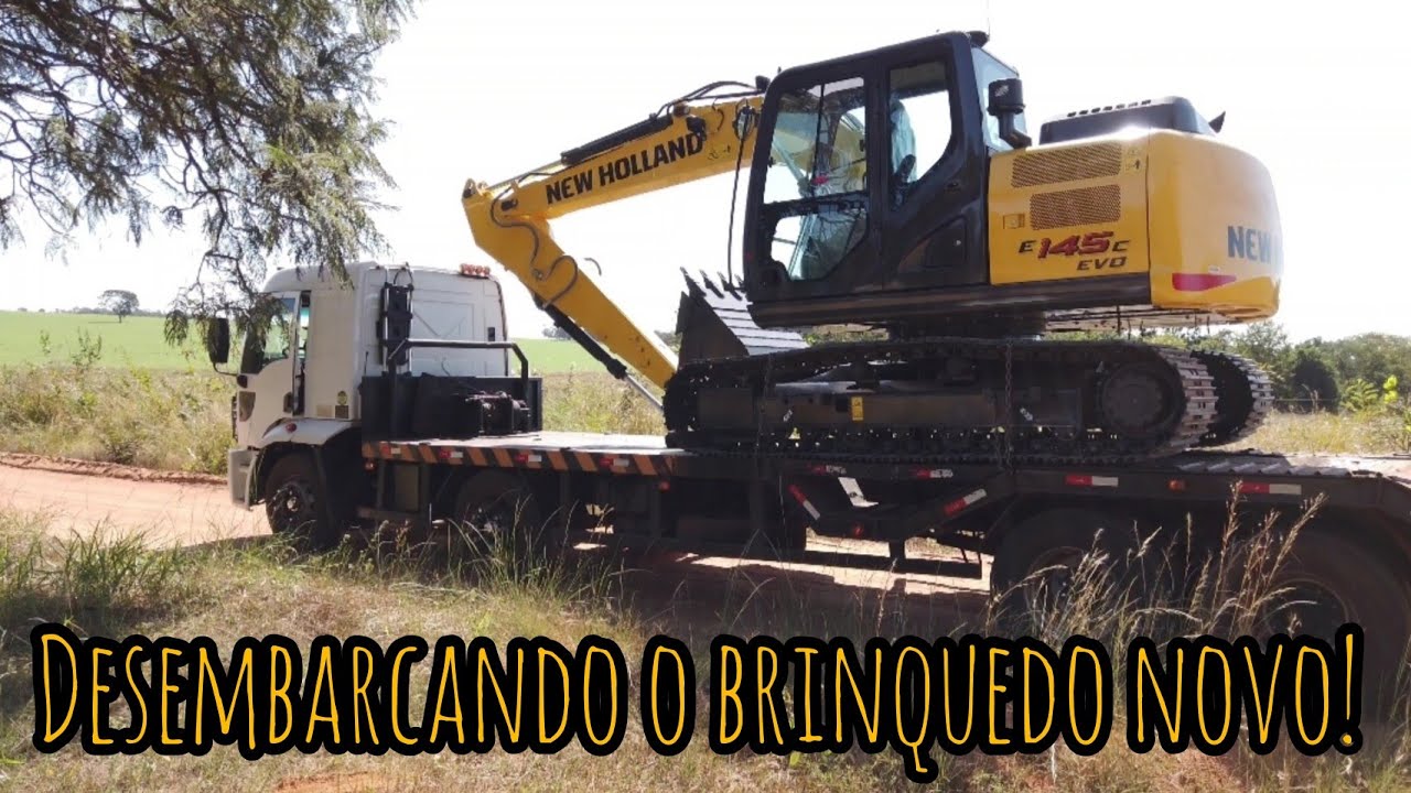 DESCENDO A MÁQUINA NOVA DO CAMINHÃO: ESCAVADEIRA HIDRÁULICA NEW HOLLAND