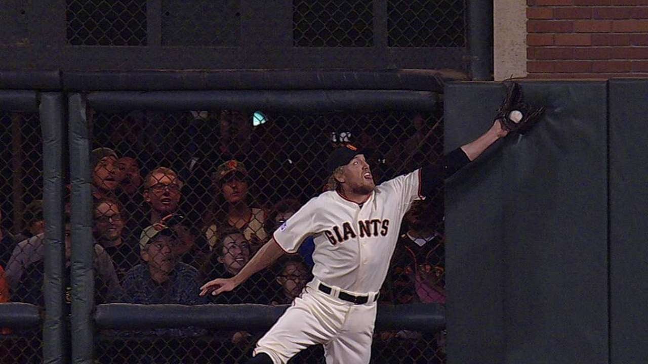 Pence leaps at the wall to rob Werth