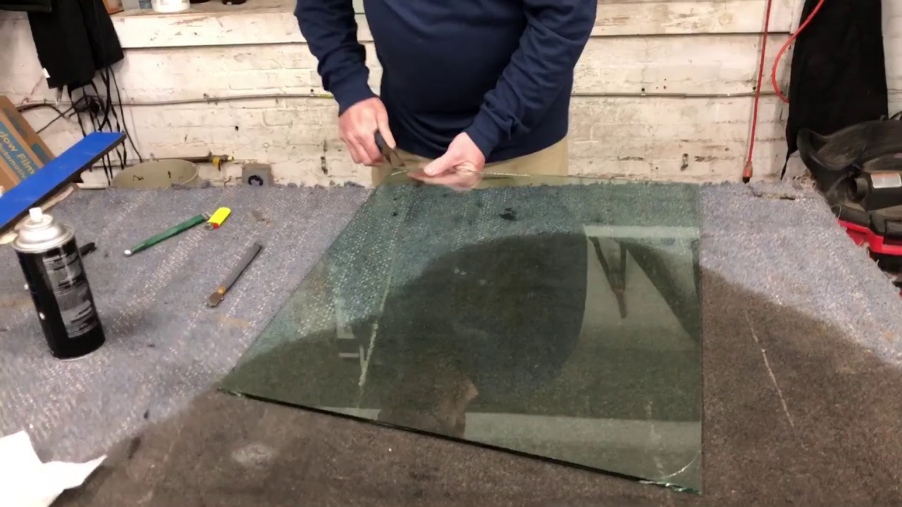 Cutting laminate glass