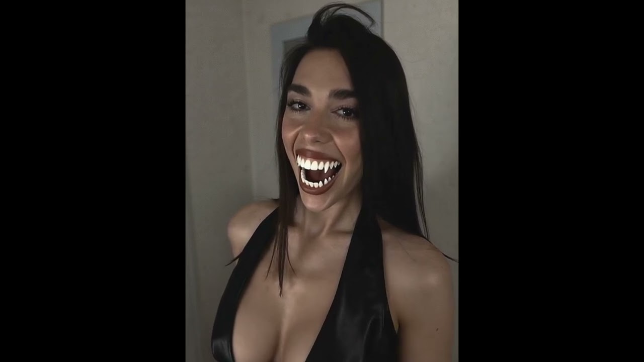 DUA LIPA’s Vampire Transformation – Fangs On!