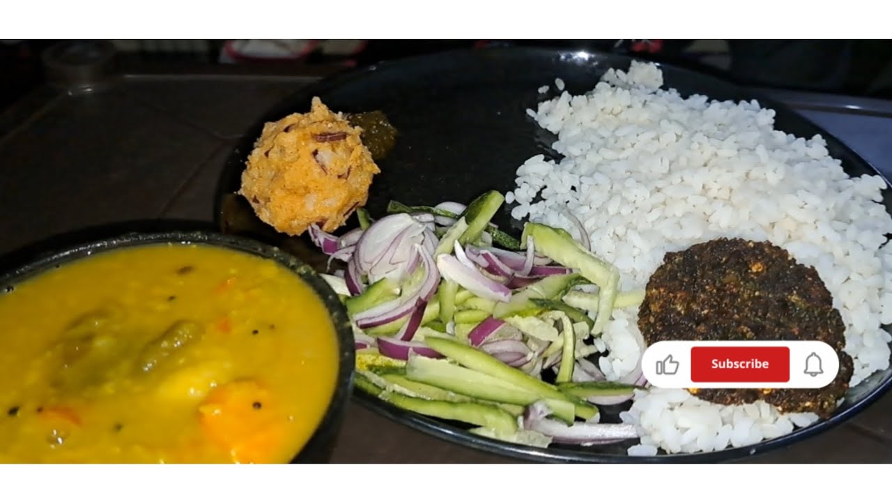 Eating...Rice,dalma,alubharata, pitagambara,dhaniachutney, salad..