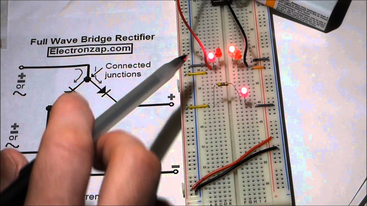 Electronics circuit. Full wave bridge rectifier. LEDs and 1N4001 diodes. Rectifier component shown.