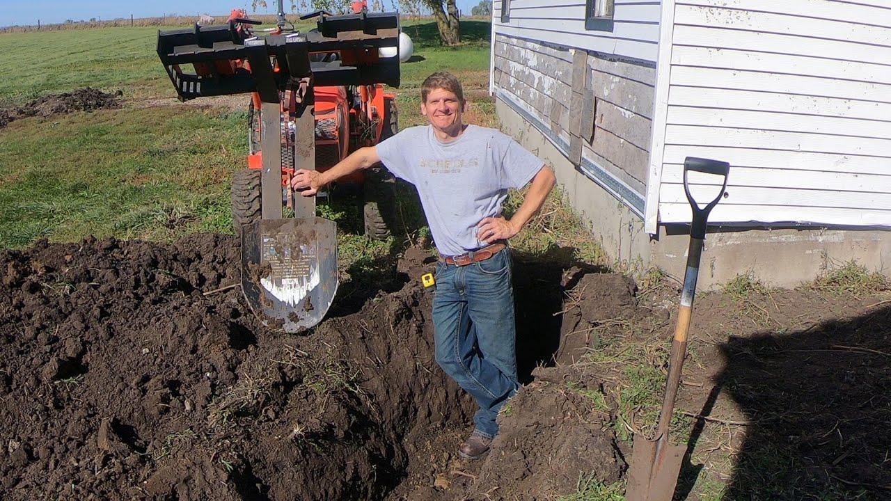 Digging trenches with Kubota B2601 - Bittersweet house flip part 15