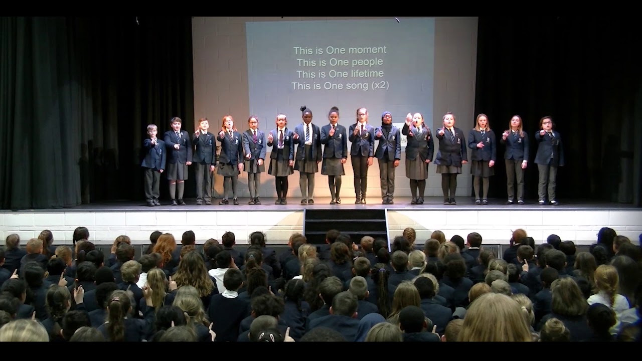 'One moment, one people' performed by The Premier Academy