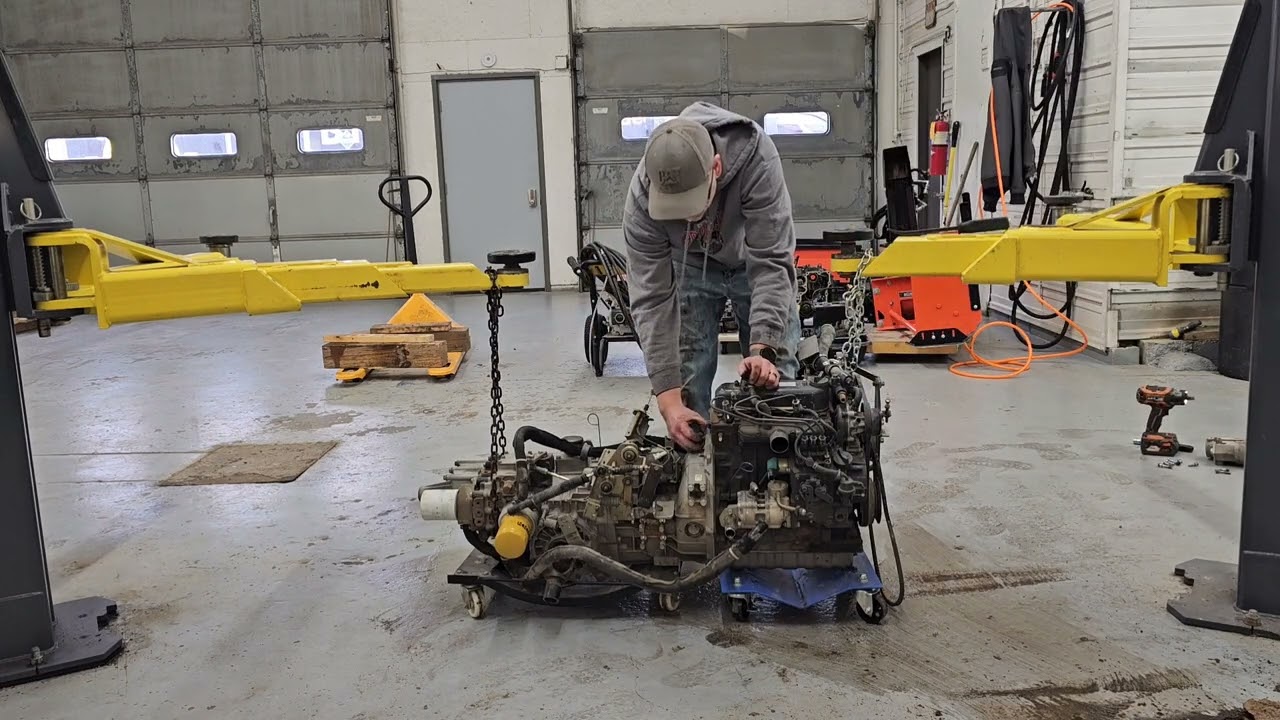How to separate the engine and transmission from the subframe in a Kubota RTV 1100