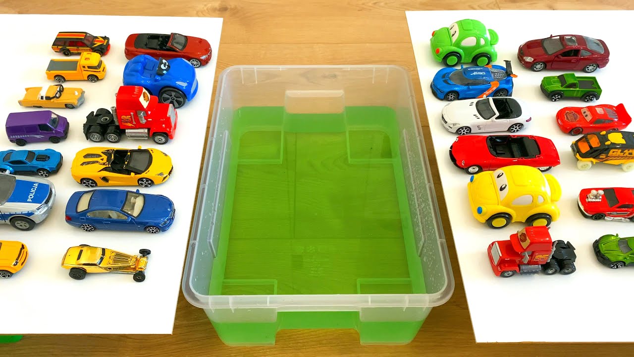 Diecast Cars Sliding Into The Green Water