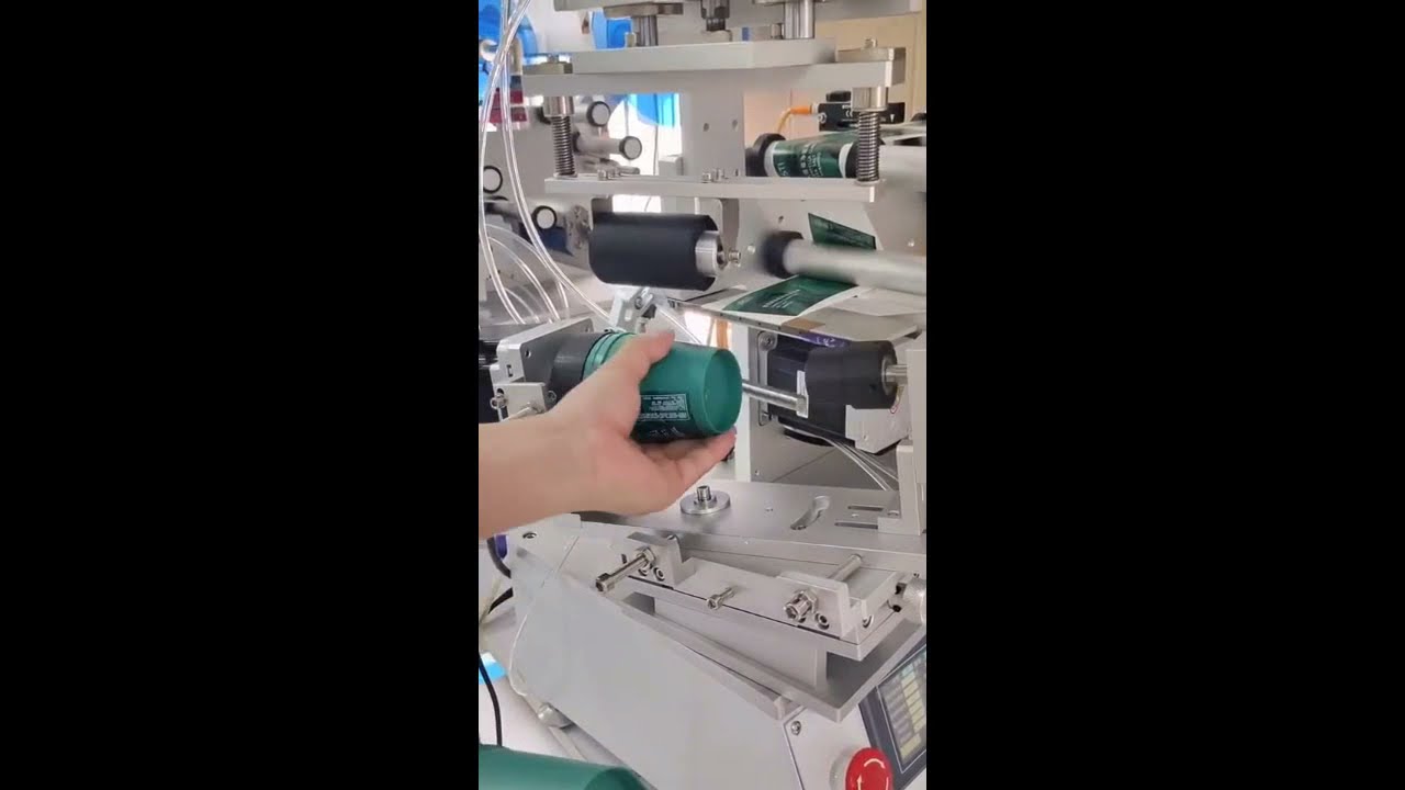 Desktop labeling machine for tapered conical cups