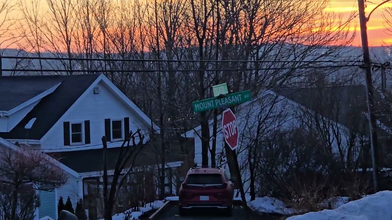 Spring Forward to Change: orange Sky and Blue Moon 2026  Copyright Joe Leger 2026