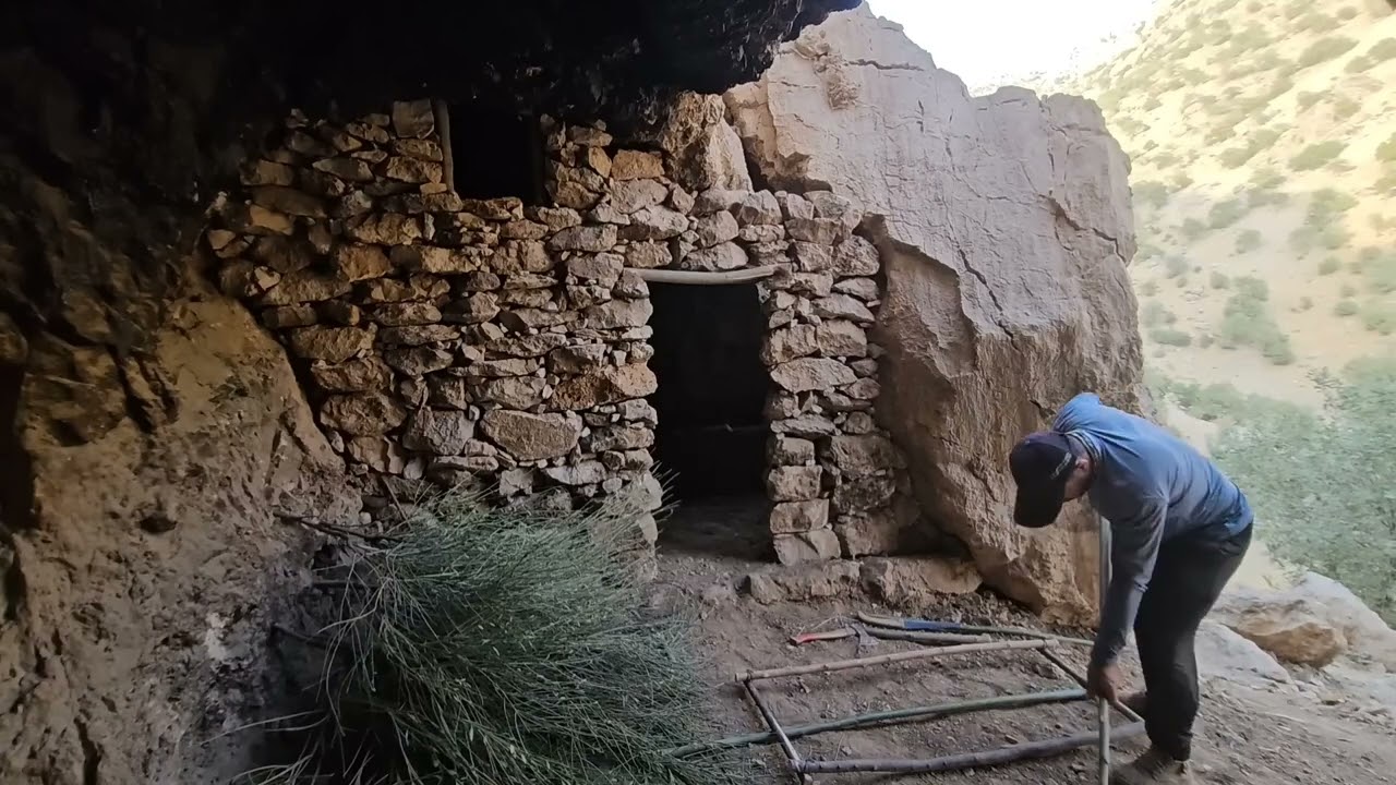 Building a Stone Shelter Under a Giant Rock   solo Cave Survival and fireplac