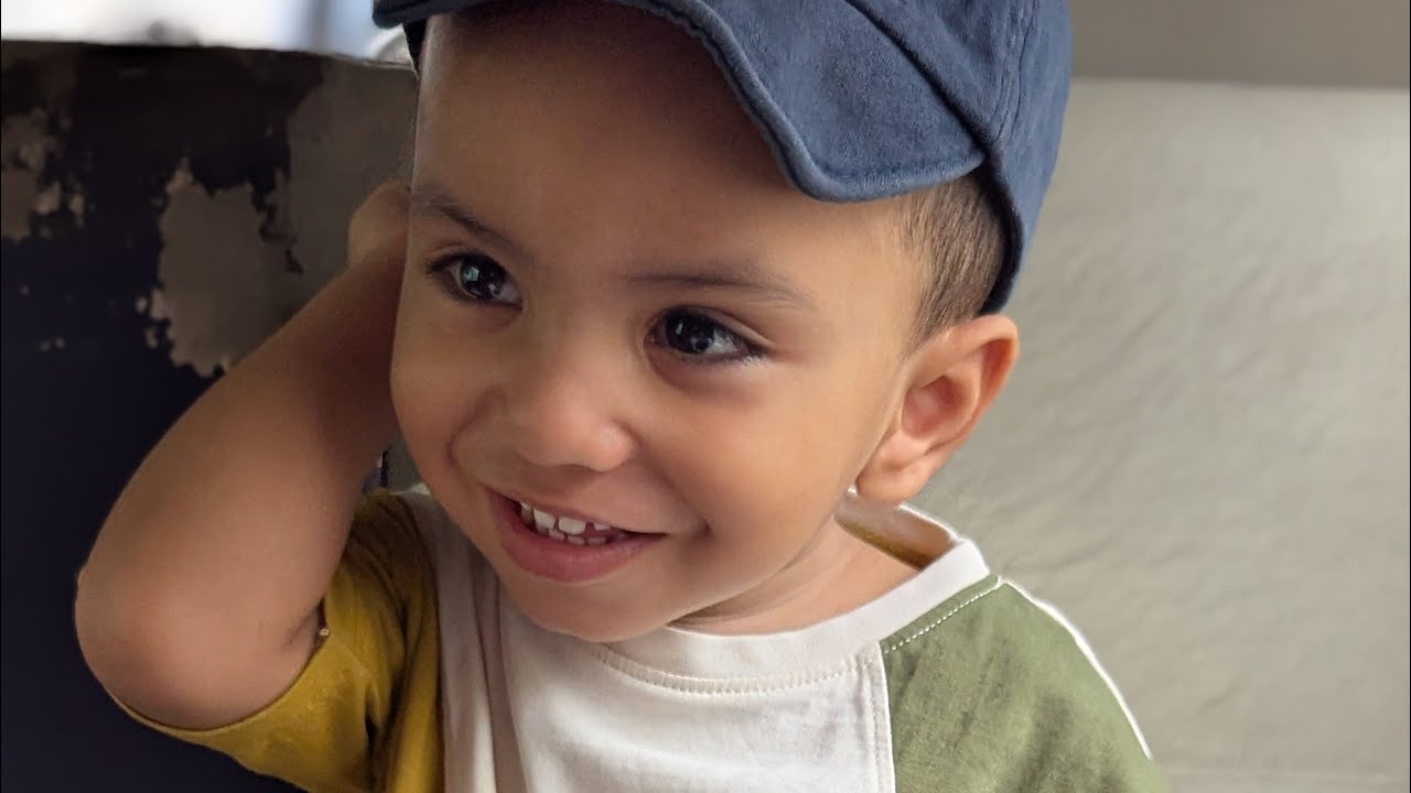 Abaan eating fruits and playing with toys