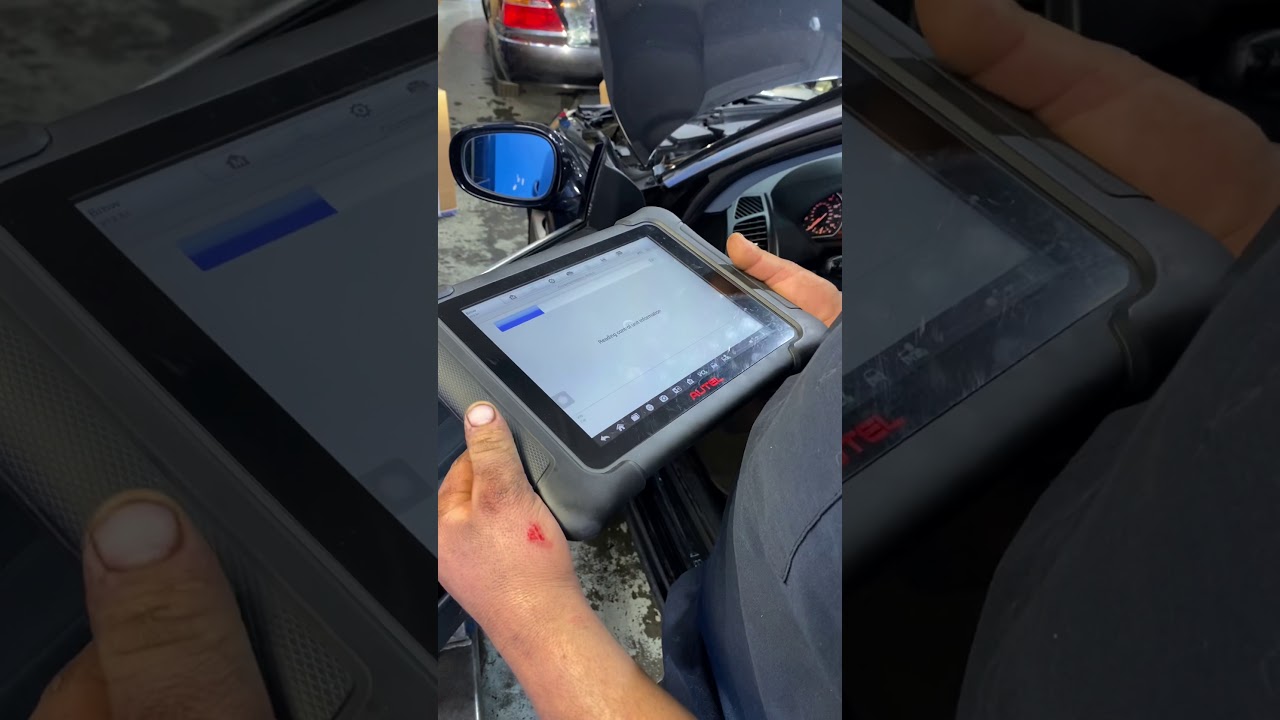Resetting BMW oil service with AUTEL vehicle scanning tool.