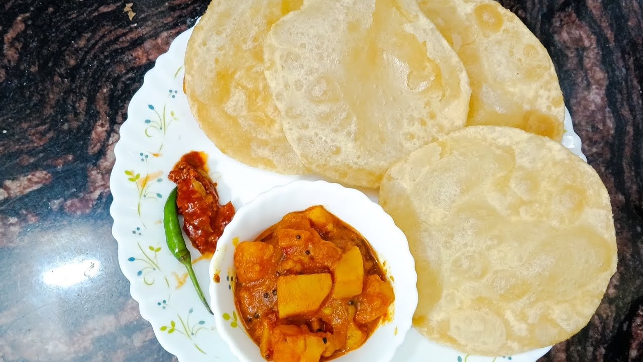 Aloo  ki tikhi sabji with puri.