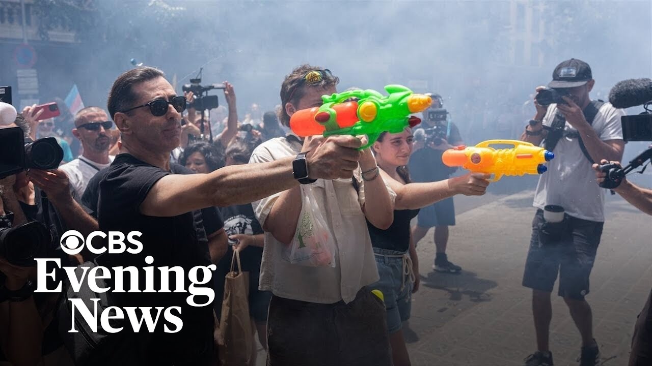 Some Spanish residents, armed with water guns, want tourists to go home