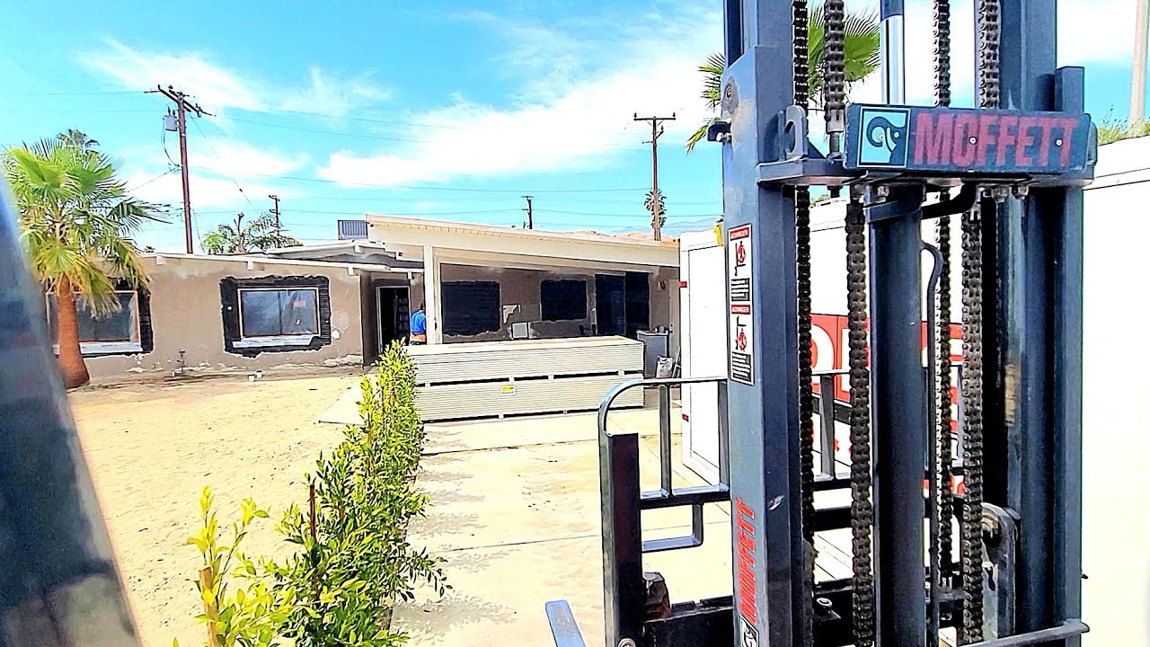 Mastering Moffett Forklifts: Delivering Drywall with Precision- Conquering POD Container obstacle.