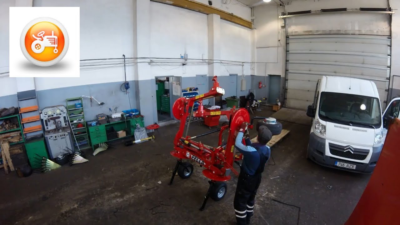 Fella TH 6606 DN mounted tedder assembly in workshop