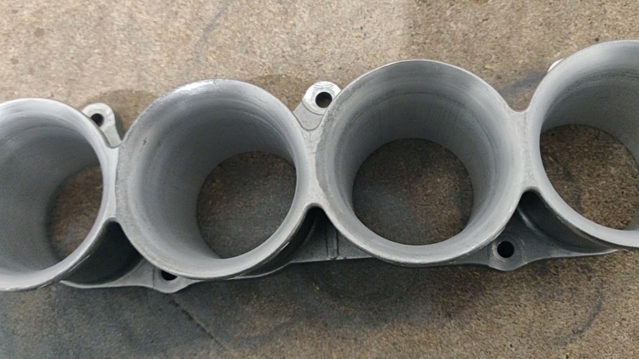 Making wider opening and cleaning fn2 k20 intake manifold trumpets...