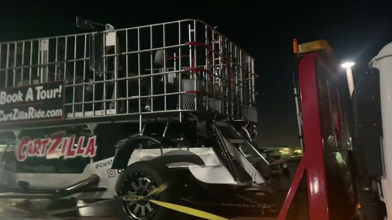 Towing a huge shopping cart with a flatbed tow truck - Chevy Tahoe frame 