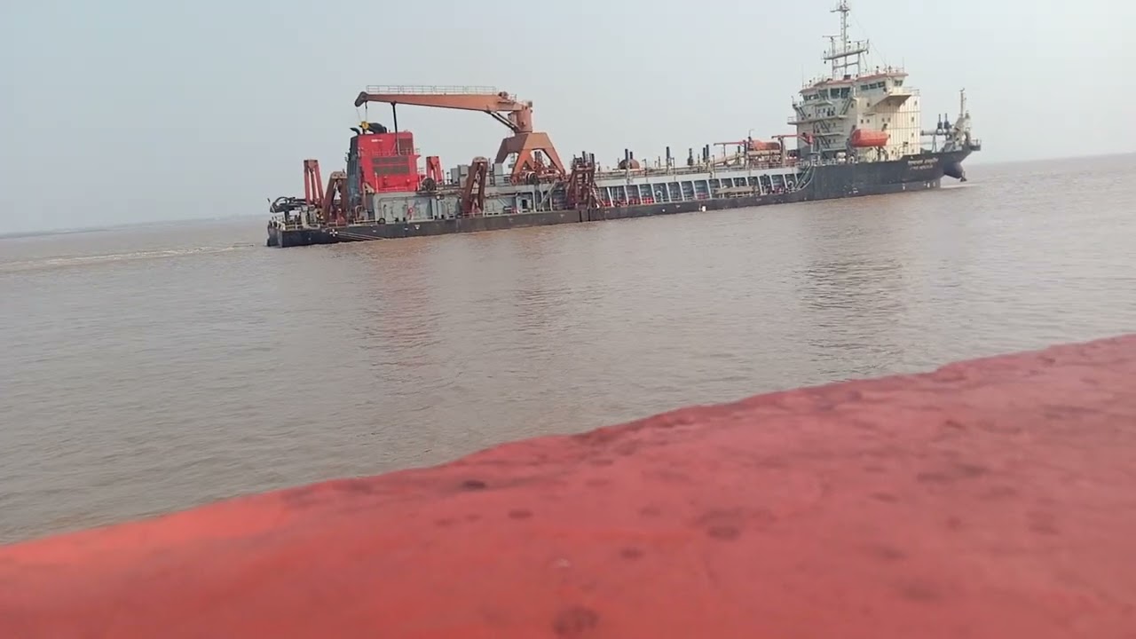 BIG DREDGING SHIP IN FRONT OF OUR SHIP
