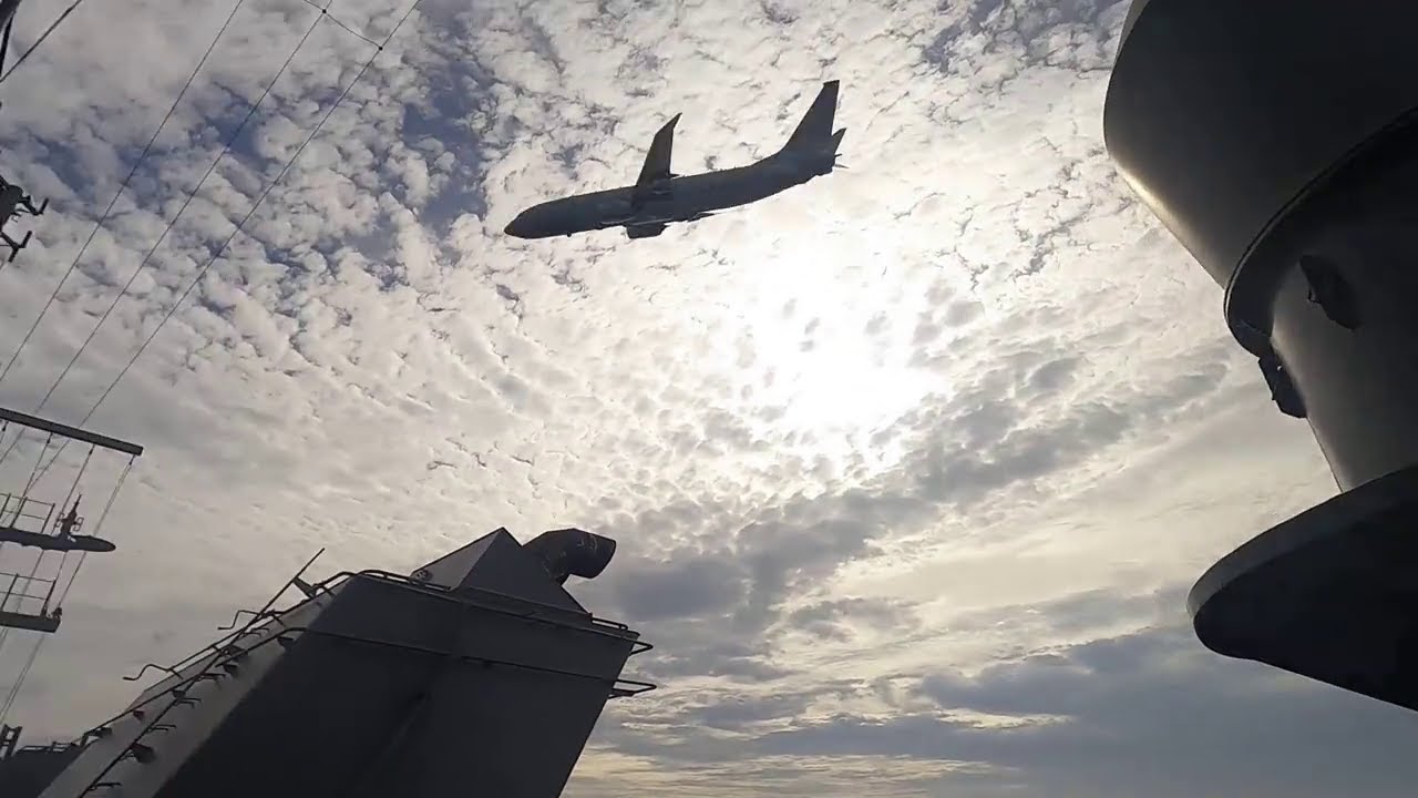 US Navy P-8A Poseidon low pass over USS America (LHA 6)