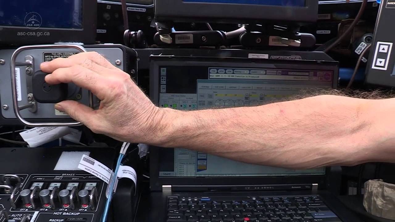 Hadfield behind the controls of Canadarm2
