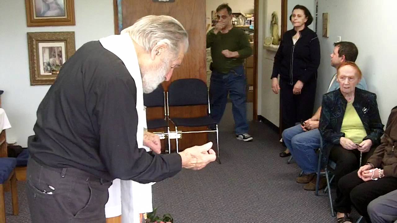 Fr. Rookey Blesses Us With Holy Water and Holy Oil at ICM Office 4-24-12