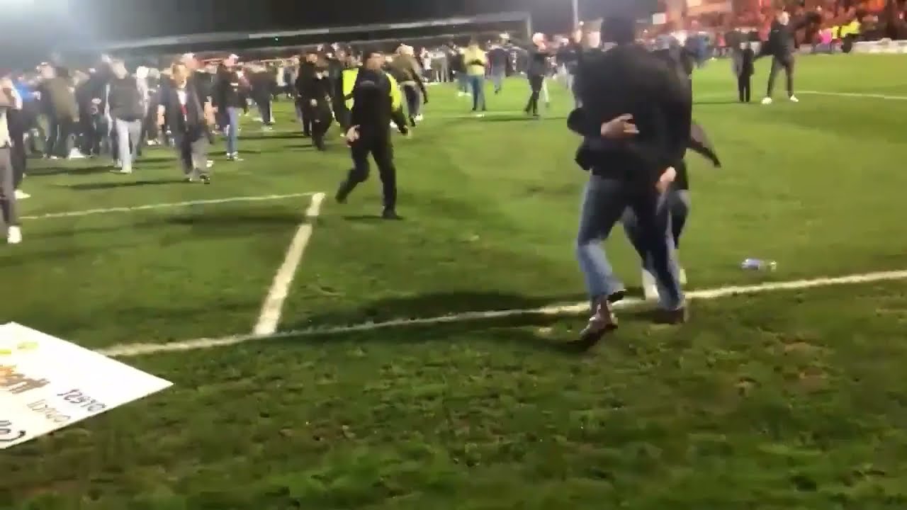 Reading FC Fans Fights Kidderminster Fans on Pitch after Defeat in FA Cup Clash