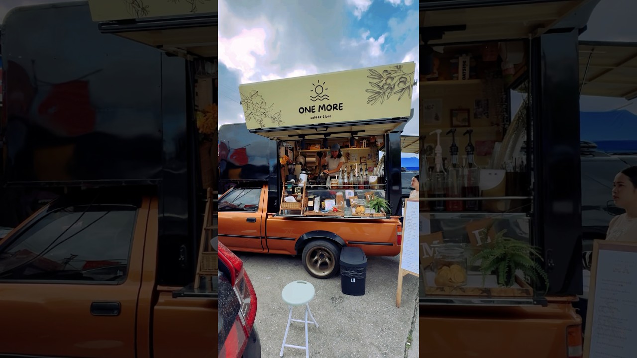 Hardworking barista girl runs mobile coffee bar from pickup truck 