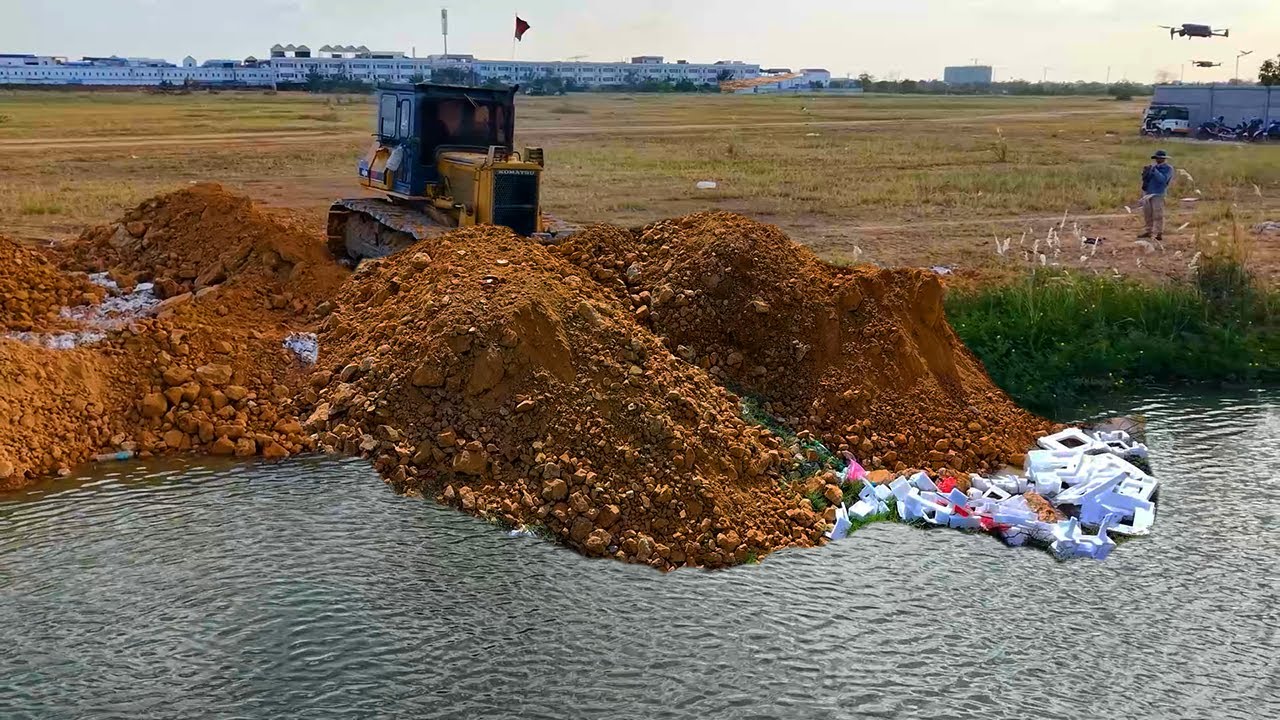 Start more step delete pit to fill resize land by SHANTUI DH17 C3 pour stone with dump truck