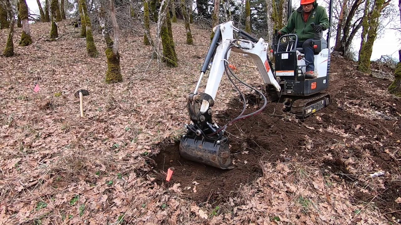 Bobcat 418 (current model: E10) w/ Tilt Bucket: Trail Building