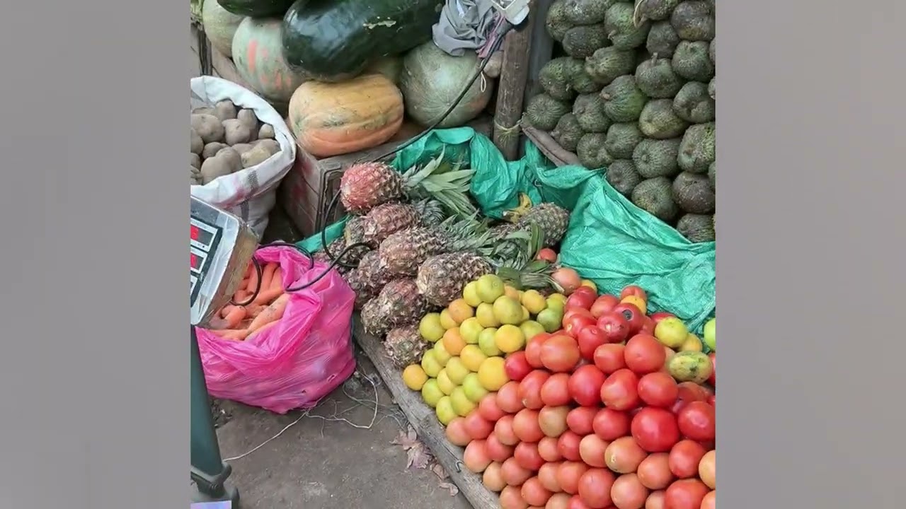 The African guy selling fruits is really good at Chinese.