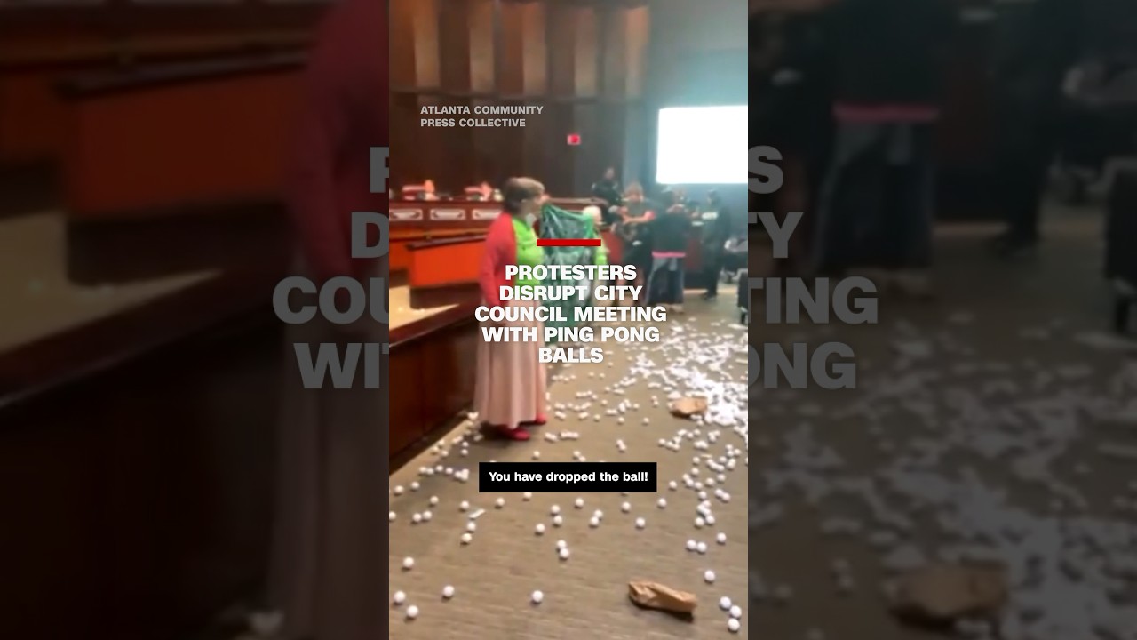Protesters disrupt city council meeting with ping pong balls