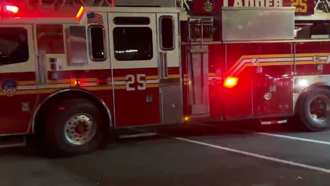 FDNY LADDER 25 RESPONDING FROM QUARTERS ON WEST 77TH STREET ON WEST SIDE OF MANHATTAN, NEW YORK CITY