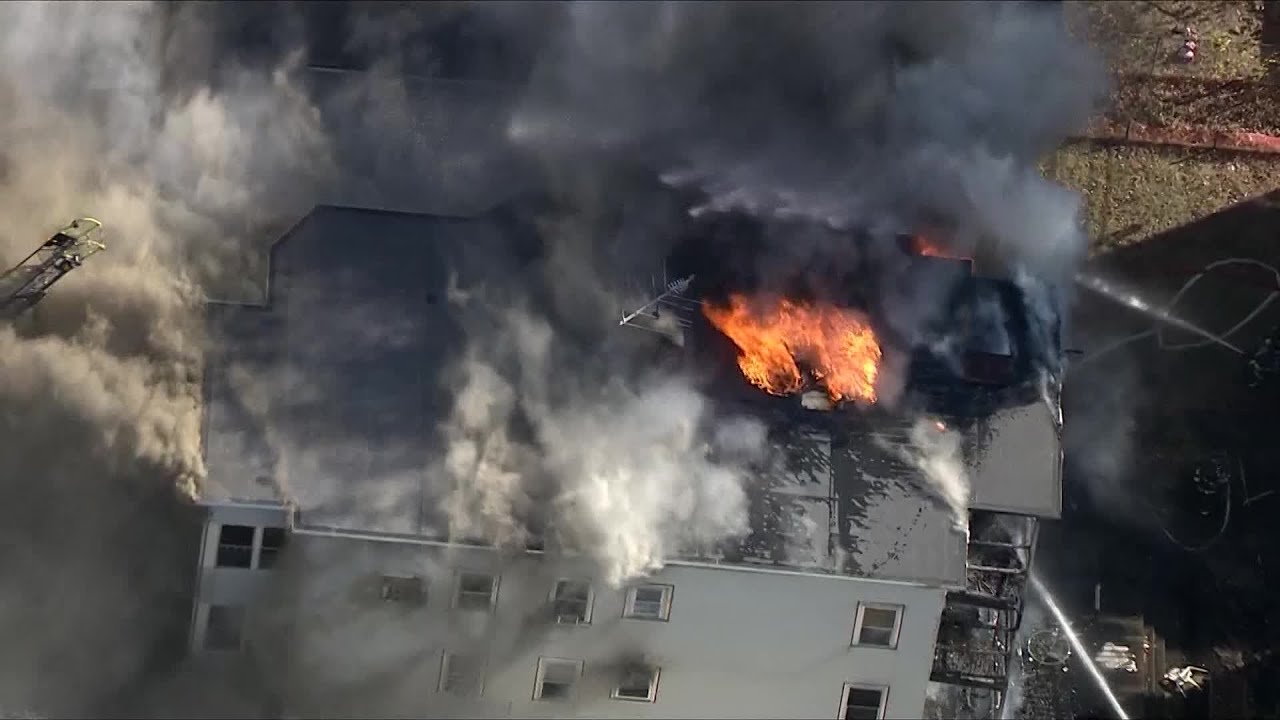 Crews battle fire in triple decker in Somerville, Massachusetts