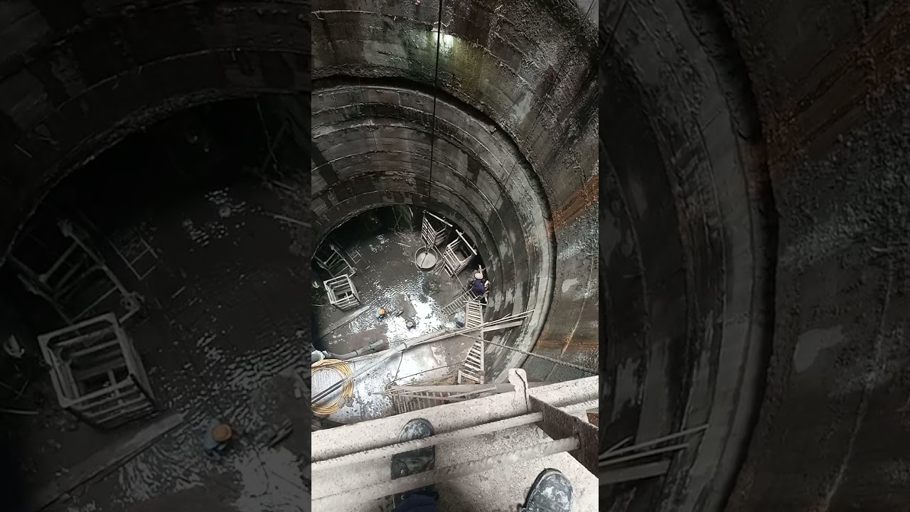 Shaft sinking.     shaft view from middle to top and bottom.